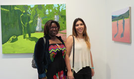 Two woman smiling in Trustman Gallery